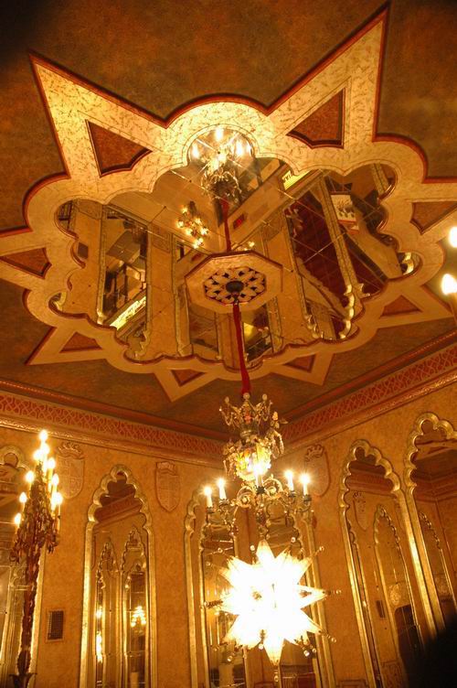 The mirrored ceiling and chandelier in the front lobby of the Alabama Theatre.